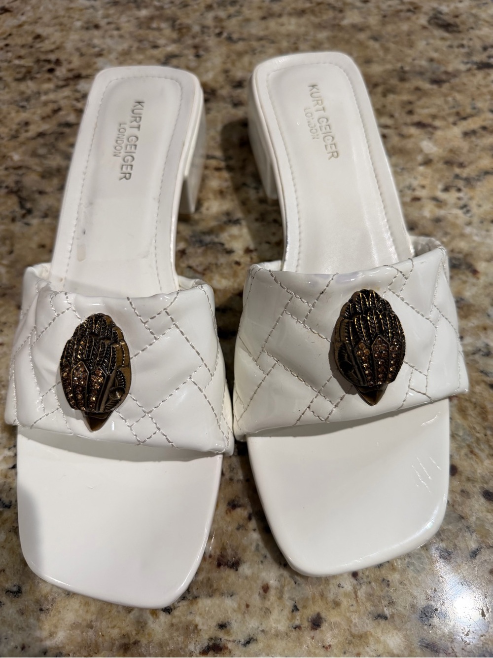 Kurt Geiger White Quilted Slide Mules with Bronze-Tone Emblem